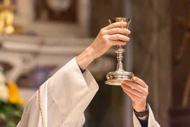 Elevated Goblet with sacramental wine during the Catholic Liturgy of the Eucharist